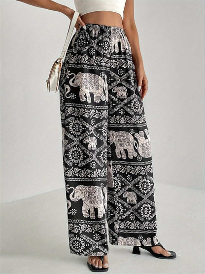 Black printed wide leg pants with elastic waist and elephant pattern.