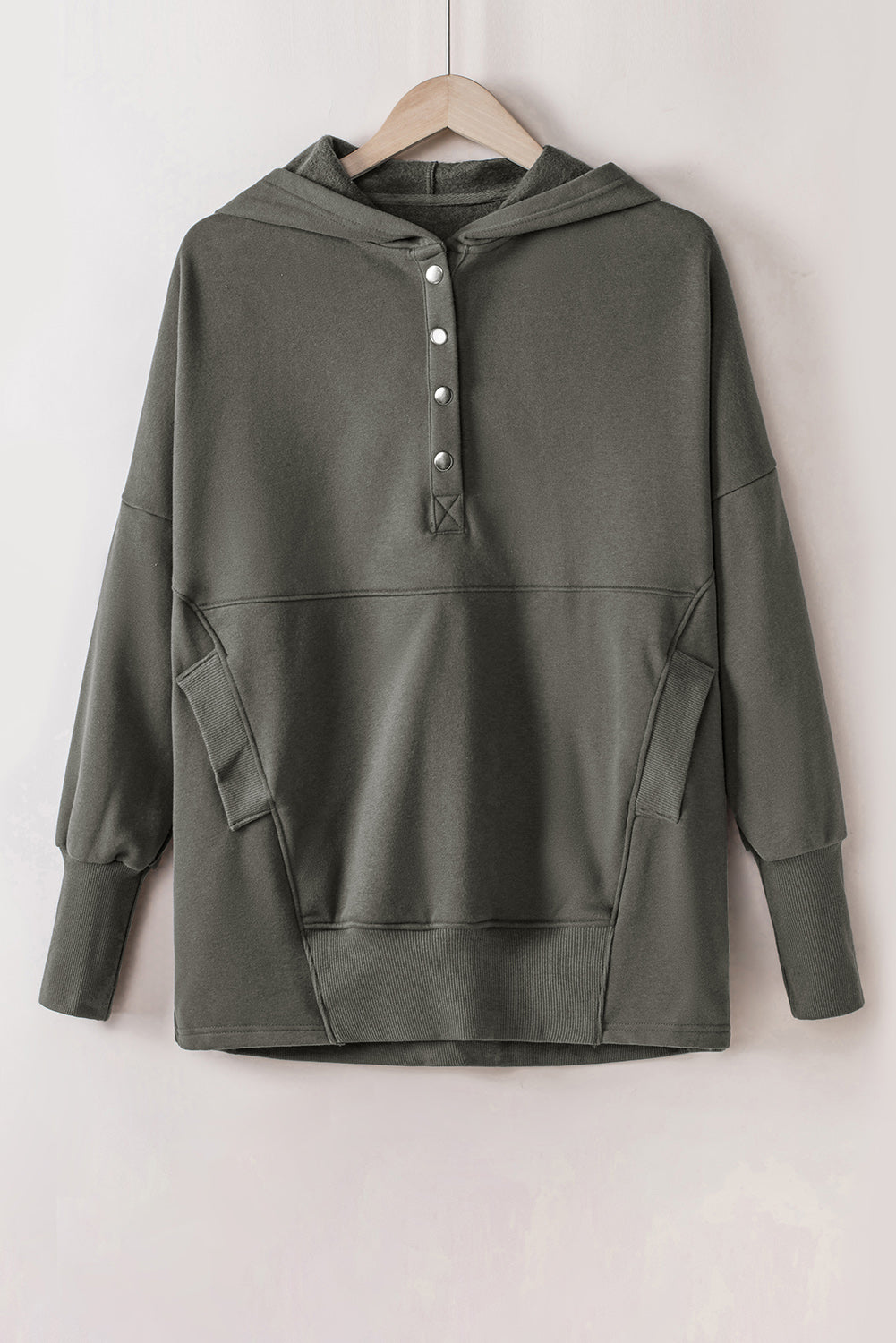 Quarter-Snap Dropped Shoulder Hoodie in green with pockets and buttons, made of polyester and cotton.