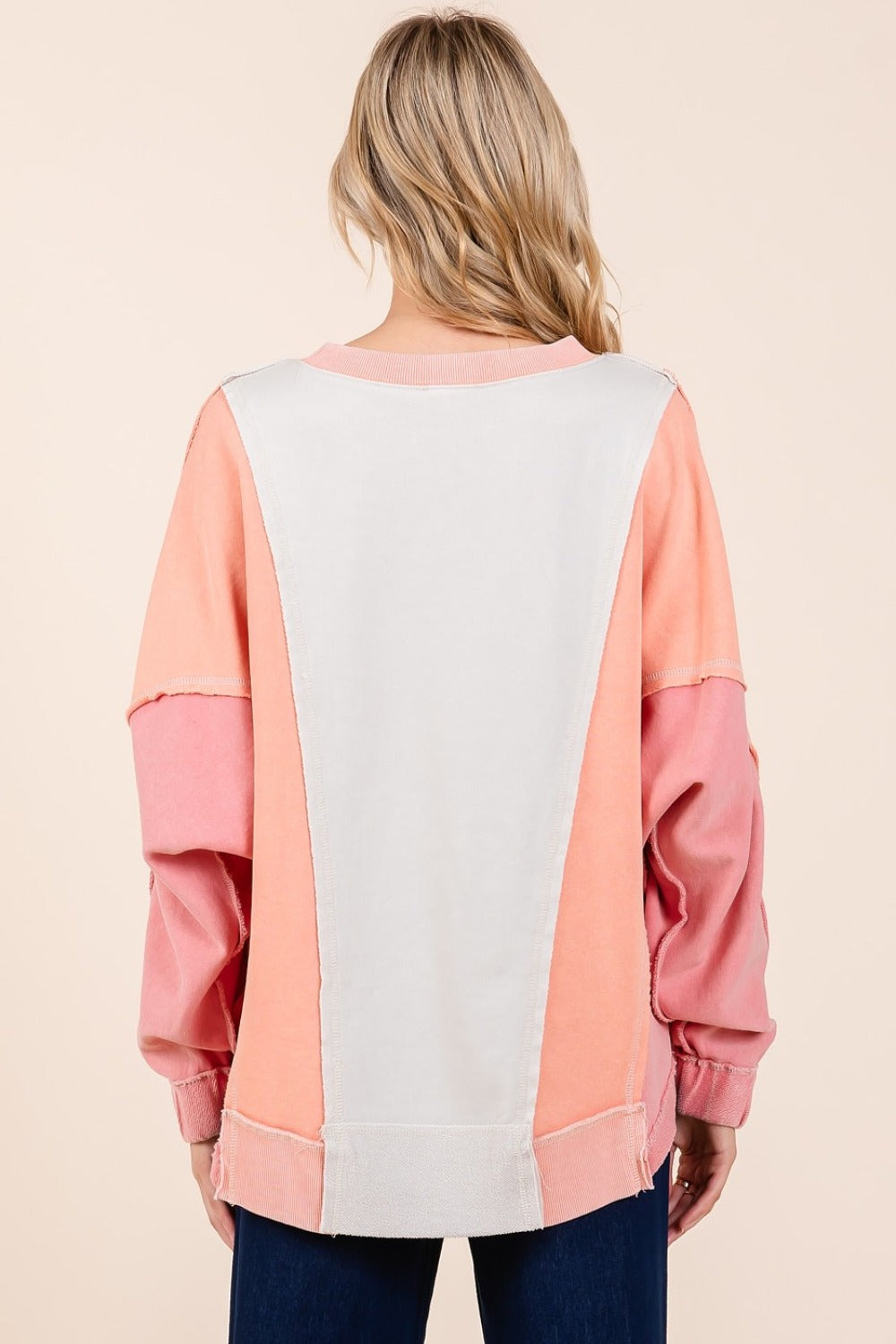 Mineral wash color block sweatshirt with dolman sleeves and exposed seaming.