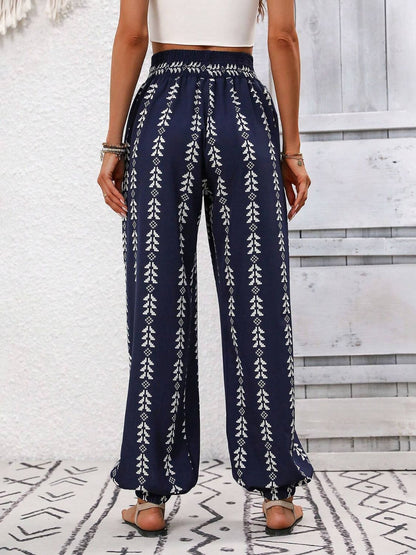 Navy blue tied printed high waist pants with white pattern.