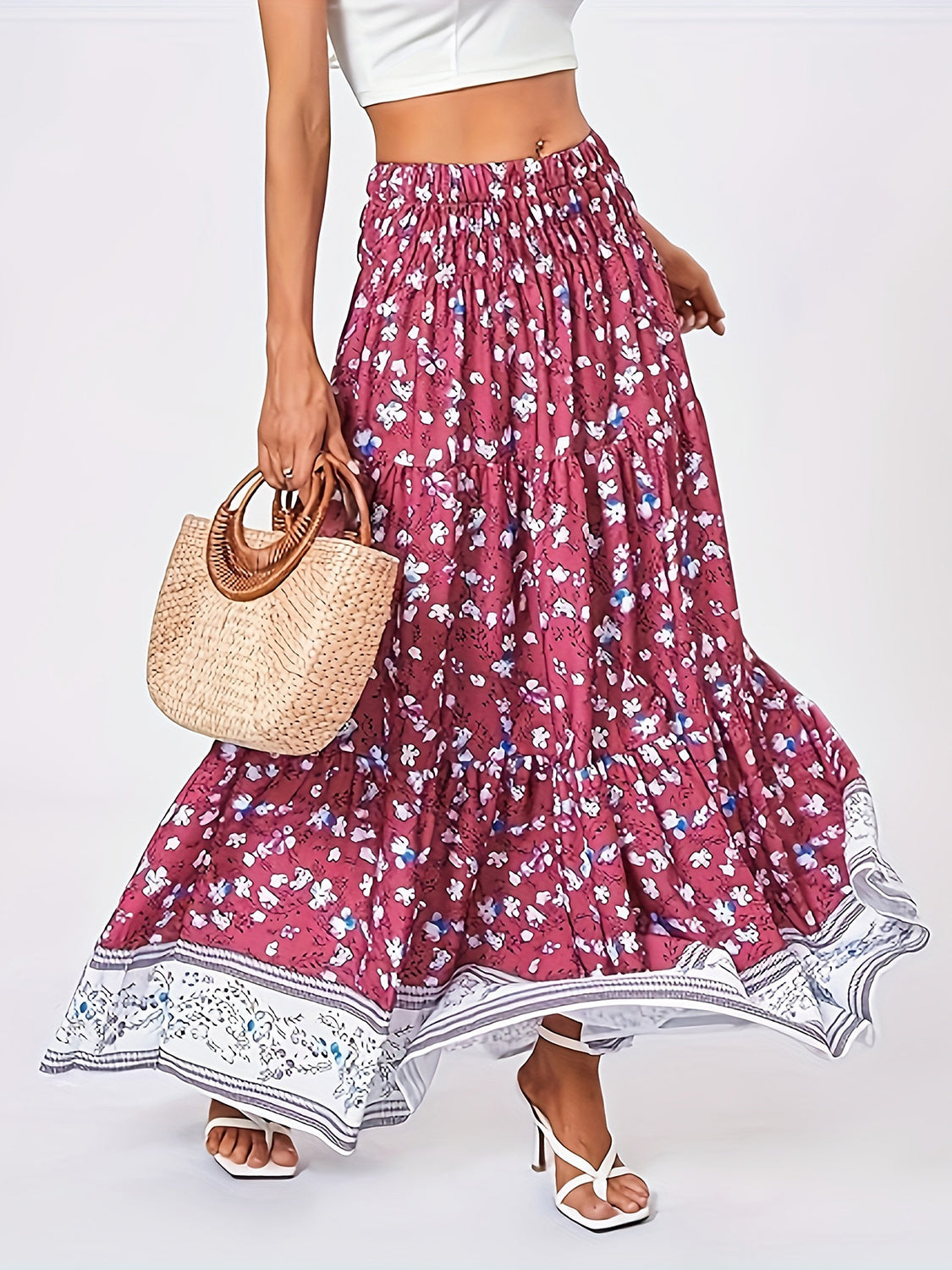 Tiered printed elastic waist skirt with floral pattern.