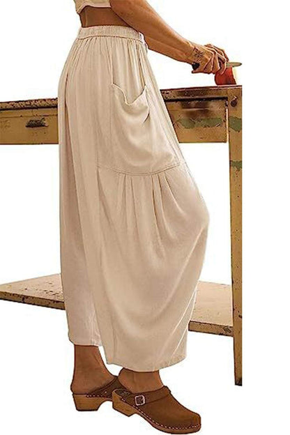 Boho wide leg harem pants with pockets in light beige color.