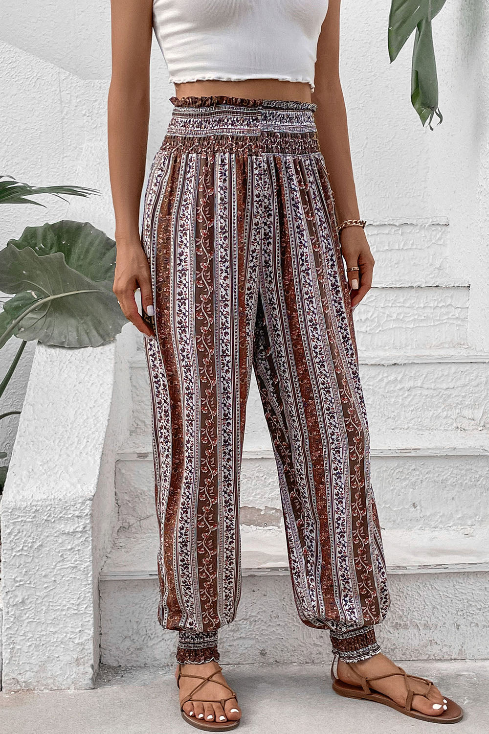 Boho print high waist joggers pants with smocked waist and 100% viscose material.