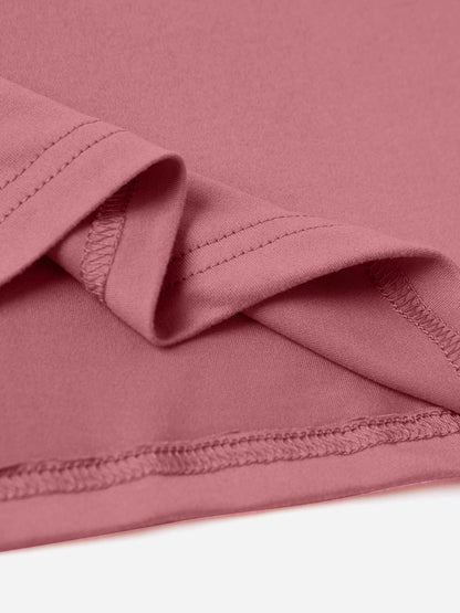 Close-up of pink Be Kind Graphic T-Shirt fabric showing seam detail.