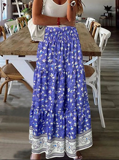 Blue tiered printed elastic waist skirt with floral design, made of polyester.