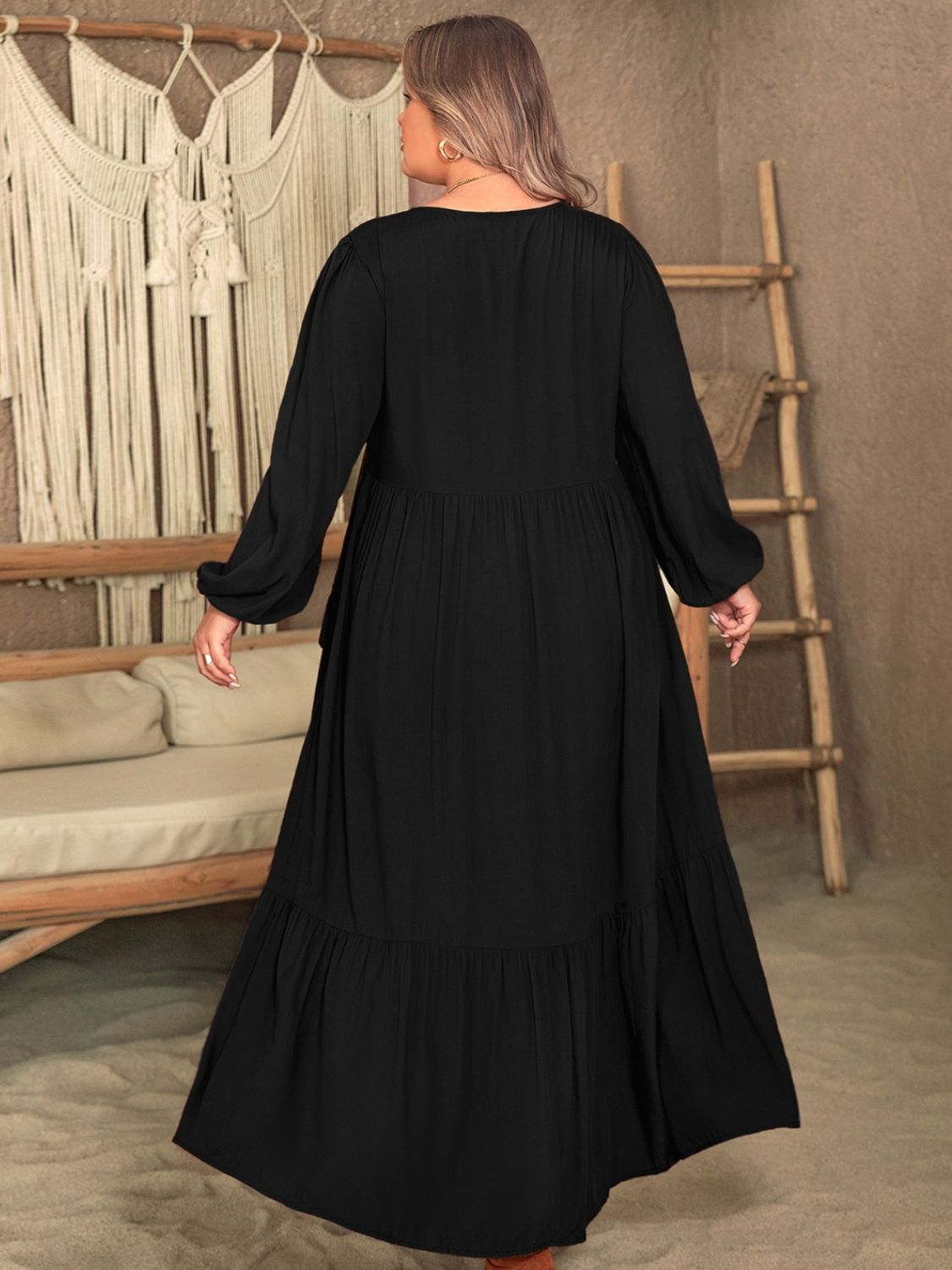 Plus size black ruffled V-neck long sleeve dress in viscose fabric.