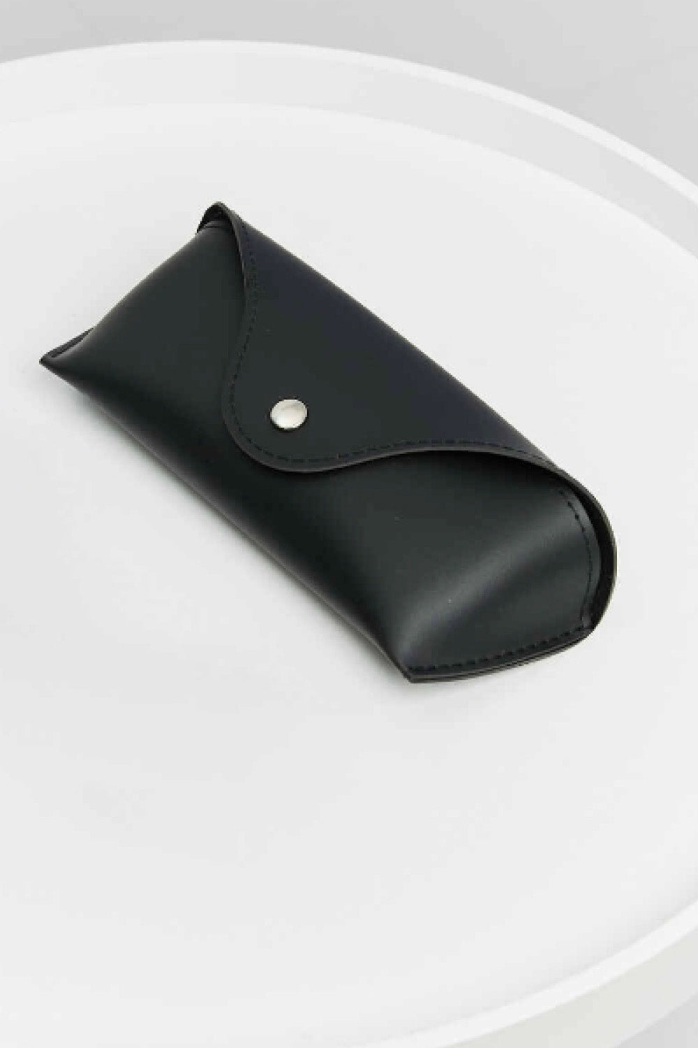 Black sunglasses case on a white background for oversized rhinestone sunglasses.