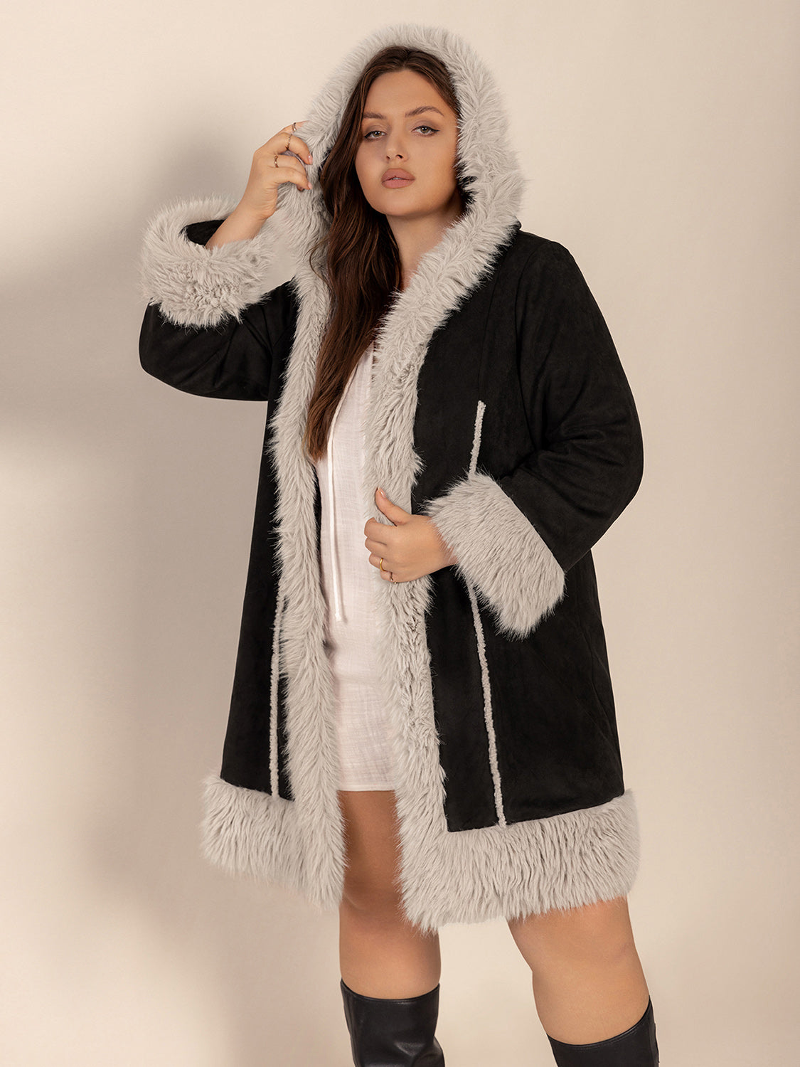 Plus size long sleeve hooded coat with fuzzy trim and open front style.