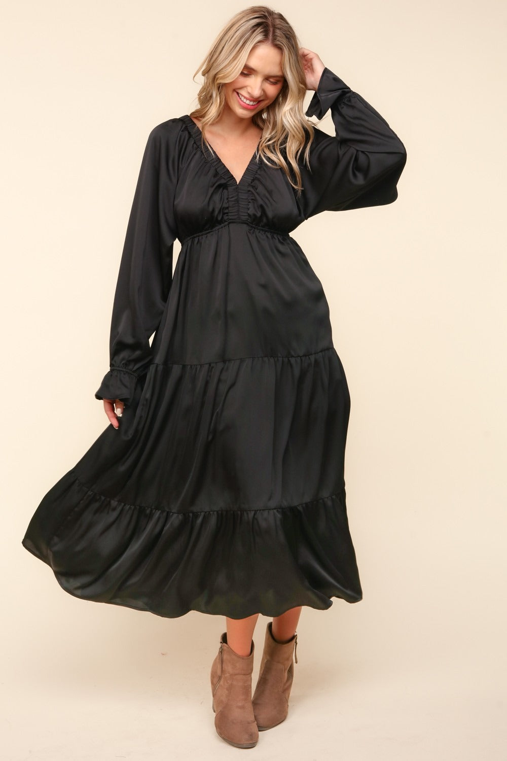 Flounce sleeve tiered midi dress with pockets in black, elegant and flowy design.