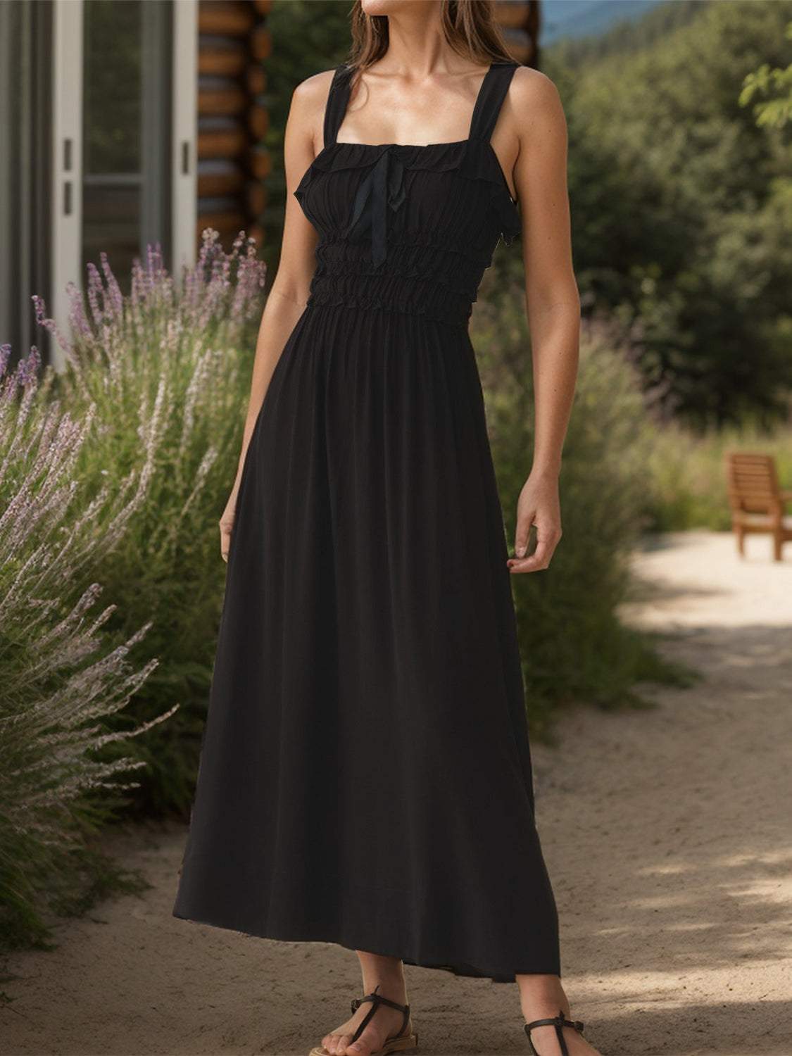 Frilled square neck wide strap dress in black with tied feature and slightly stretchy fabric.