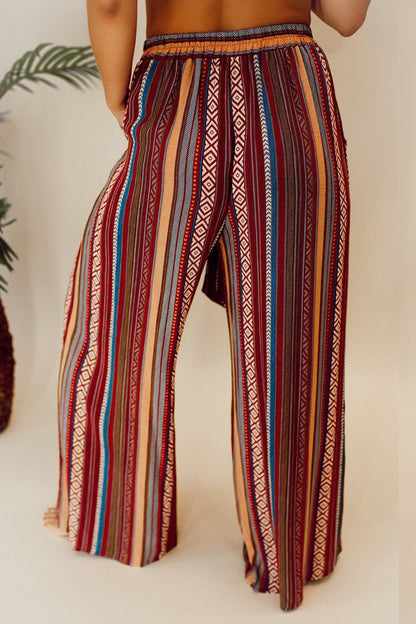 Colorful bohemian wide-leg pants with a high waist and pocket details.