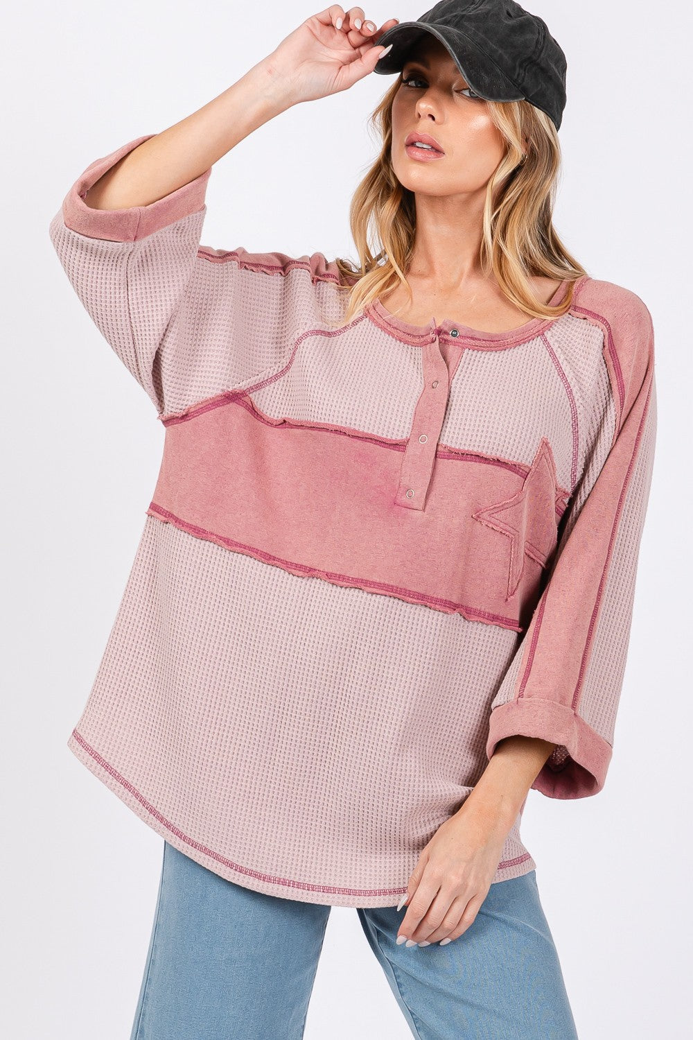 Star applique patch exposed seam waffle knit top.