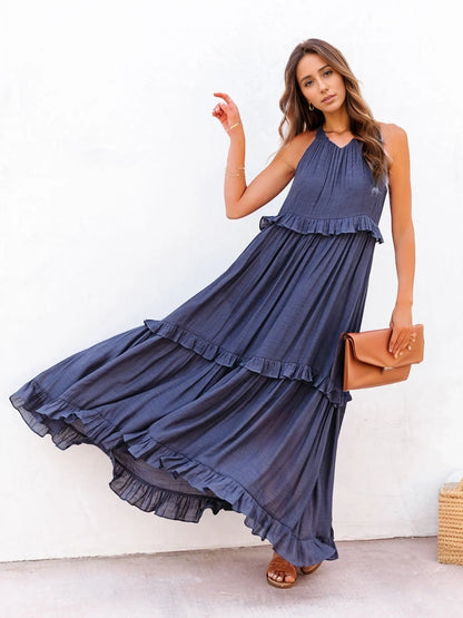 Ruffled sleeveless tiered maxi dress with pockets in blue.