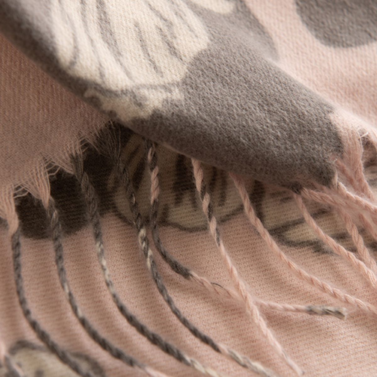 Fringe flower print scarf, polyester material, close-up detail.