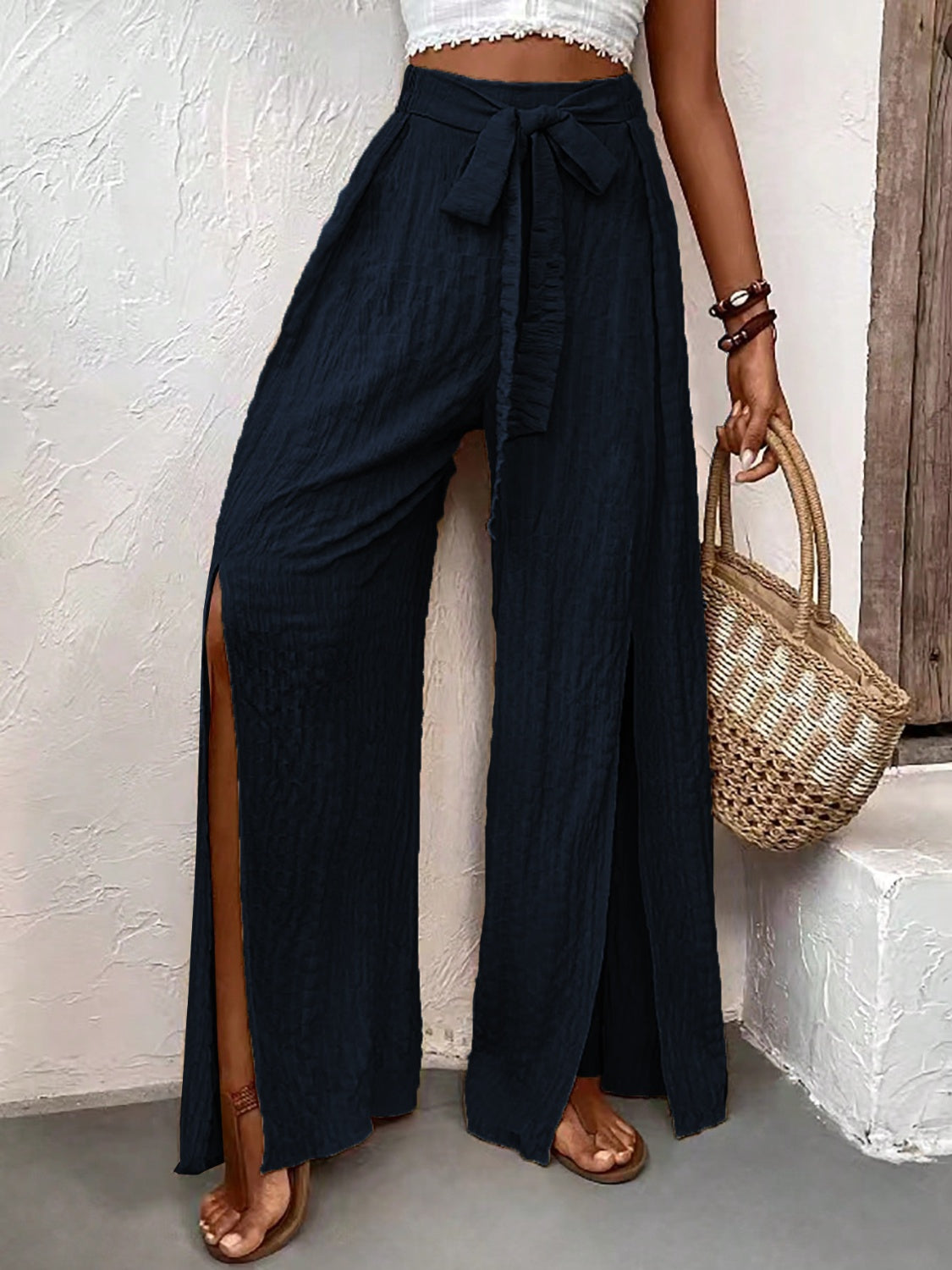 Honey Tied Slit Wide Leg Pants with bow detail and high slit design.