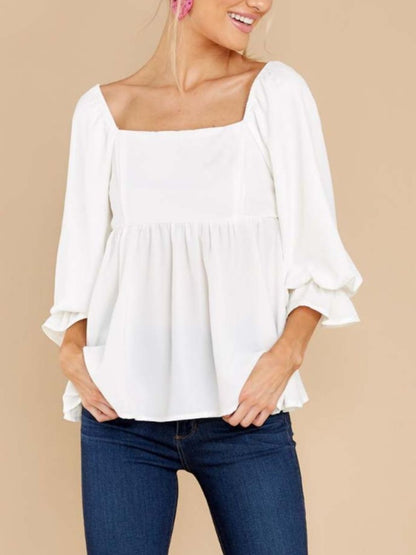 White smocked square neck blouse with flounce sleeves, opaque polyester fabric.