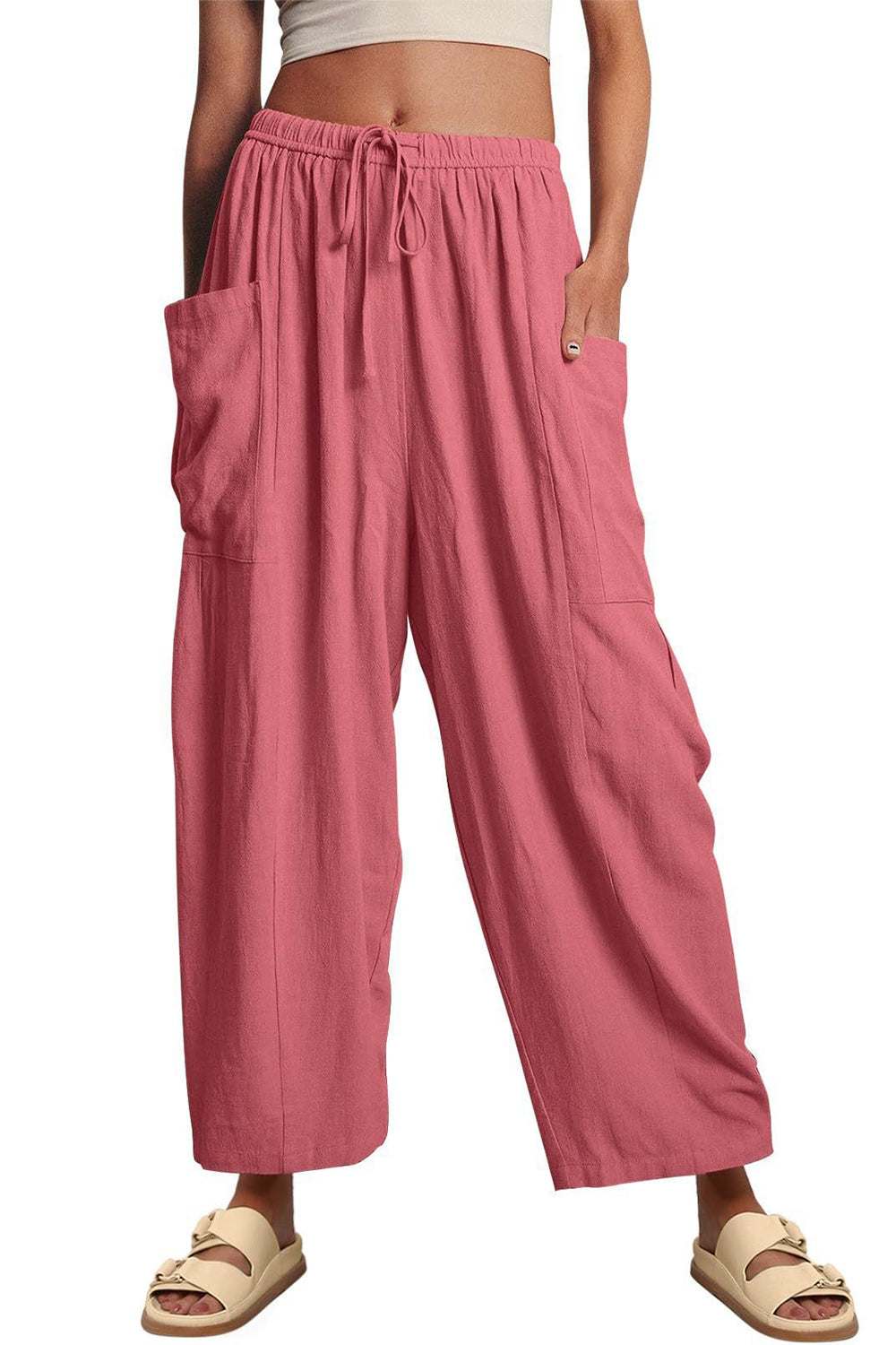 Boho wide leg harem pants with pockets in pink, made of 100% polyester.