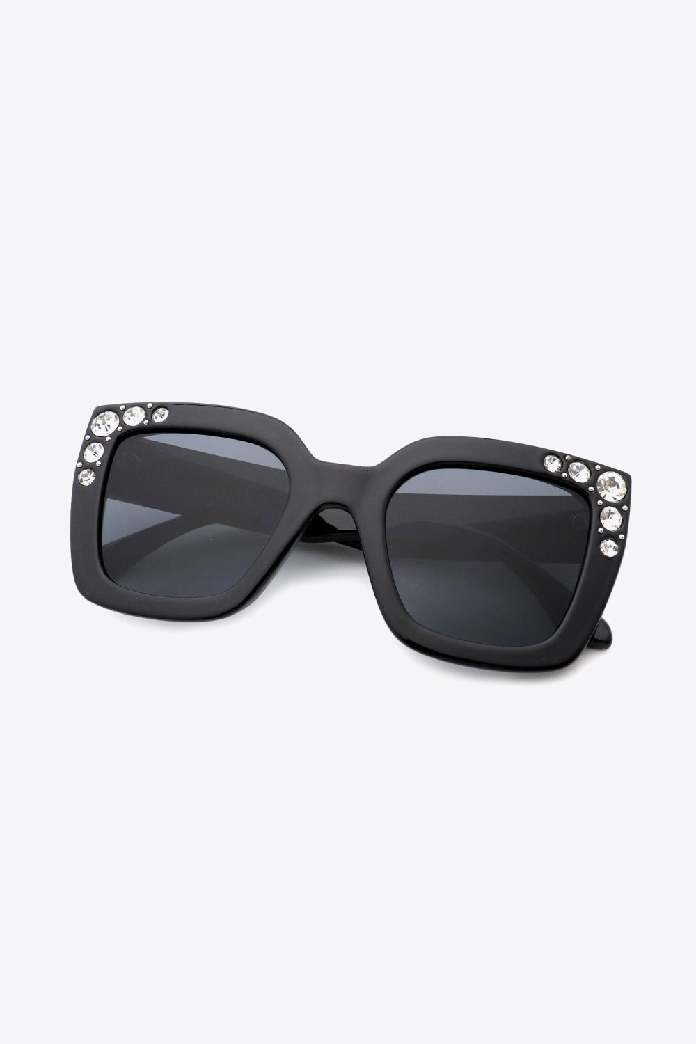 Oversized rhinestone sunglasses with UV400 protection and polycarbonate wayfarer frame.