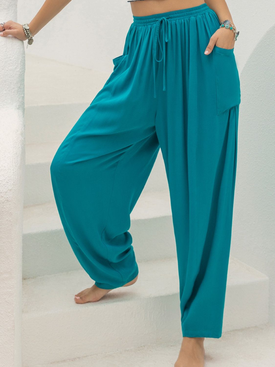 Teal drawstring wide leg pants with pockets, 100% viscose, casual and comfortable style.