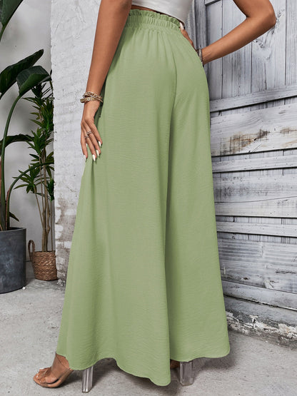 Boho high waist wide leg pants in green cotton, tied detail.