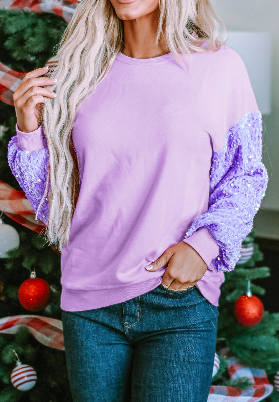 Sequin round neck long sleeve sweatshirt with purple sequin details on sleeves.