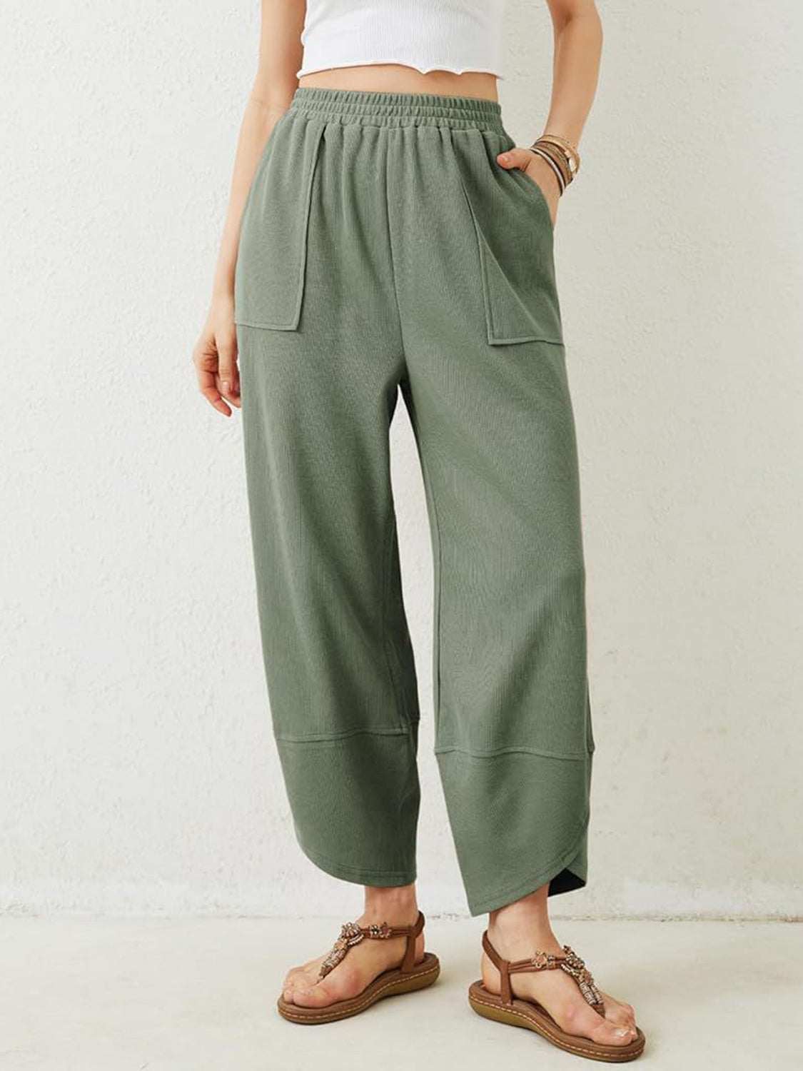 Elastic waist wide leg boho lounge pants with pockets in green.