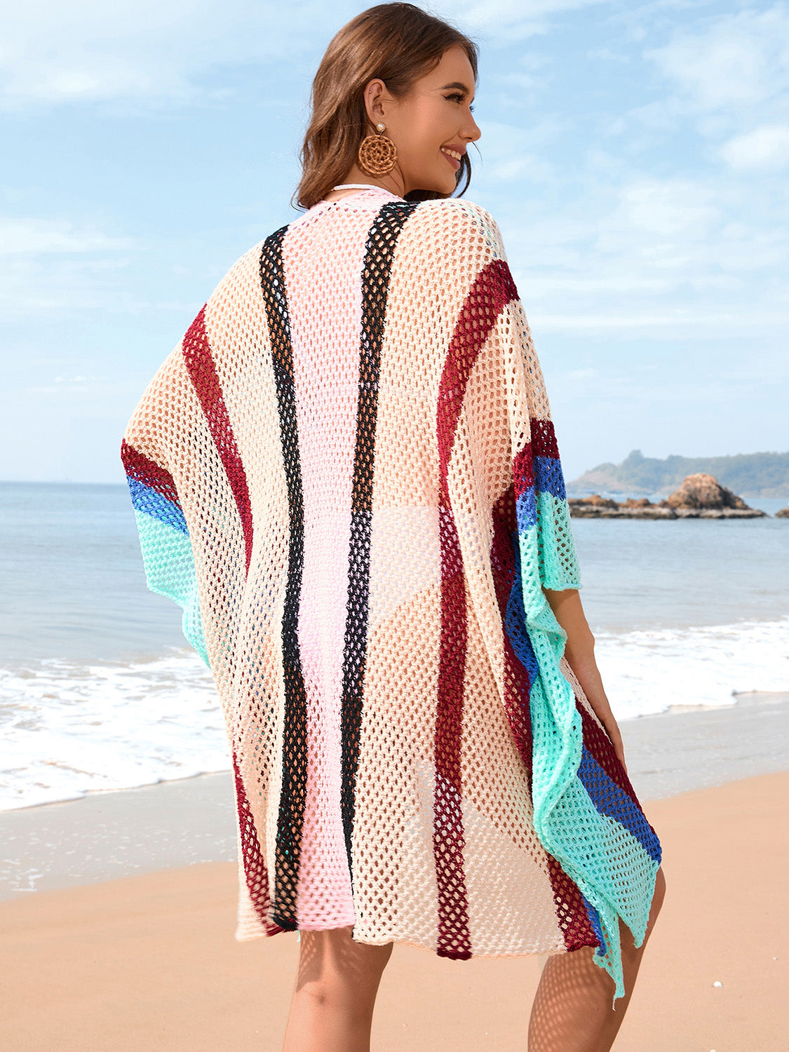 Colorful openwork beach dress with semi-sheer, stretchy design.