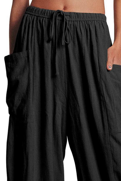 Boho wide leg harem pants with pockets in black, 100% polyester.