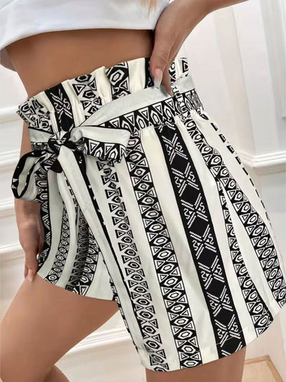 Tied geometric shorts, black and white pattern, polyester material.