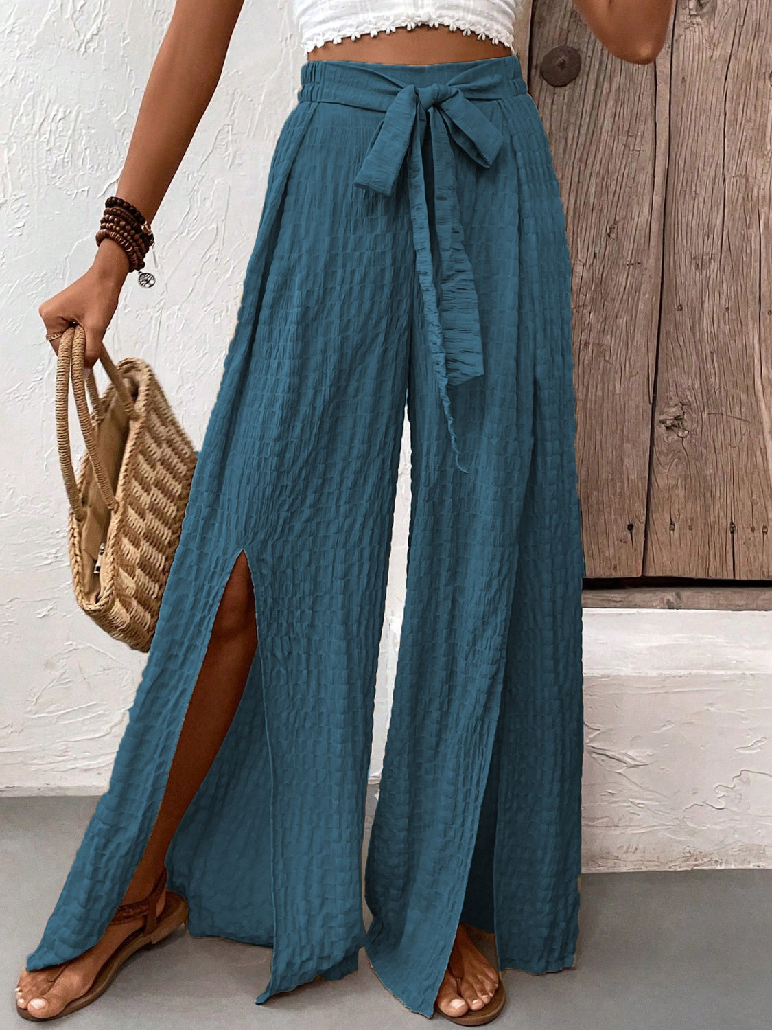 Honey Tied Slit Wide Leg Pants in blue with slit detailing and waist tie.