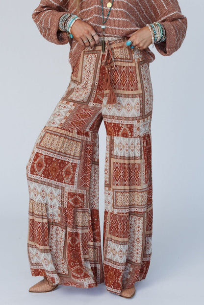 Boho wide leg high pants with drawstring in patchwork design, viscose material.