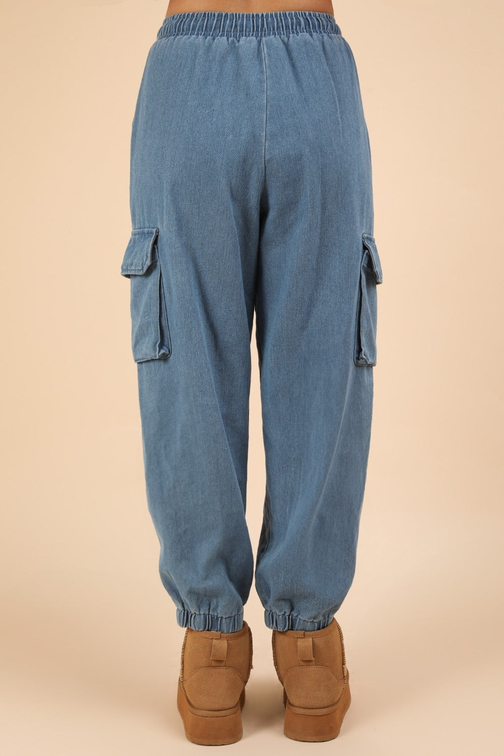 Washed Drawstring Jogger Cargo Jeans with elastic waist and side pockets.