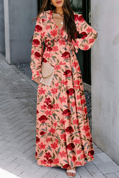 Floral print ruffle tiered maxi dress with plunging neckline and long sleeves.