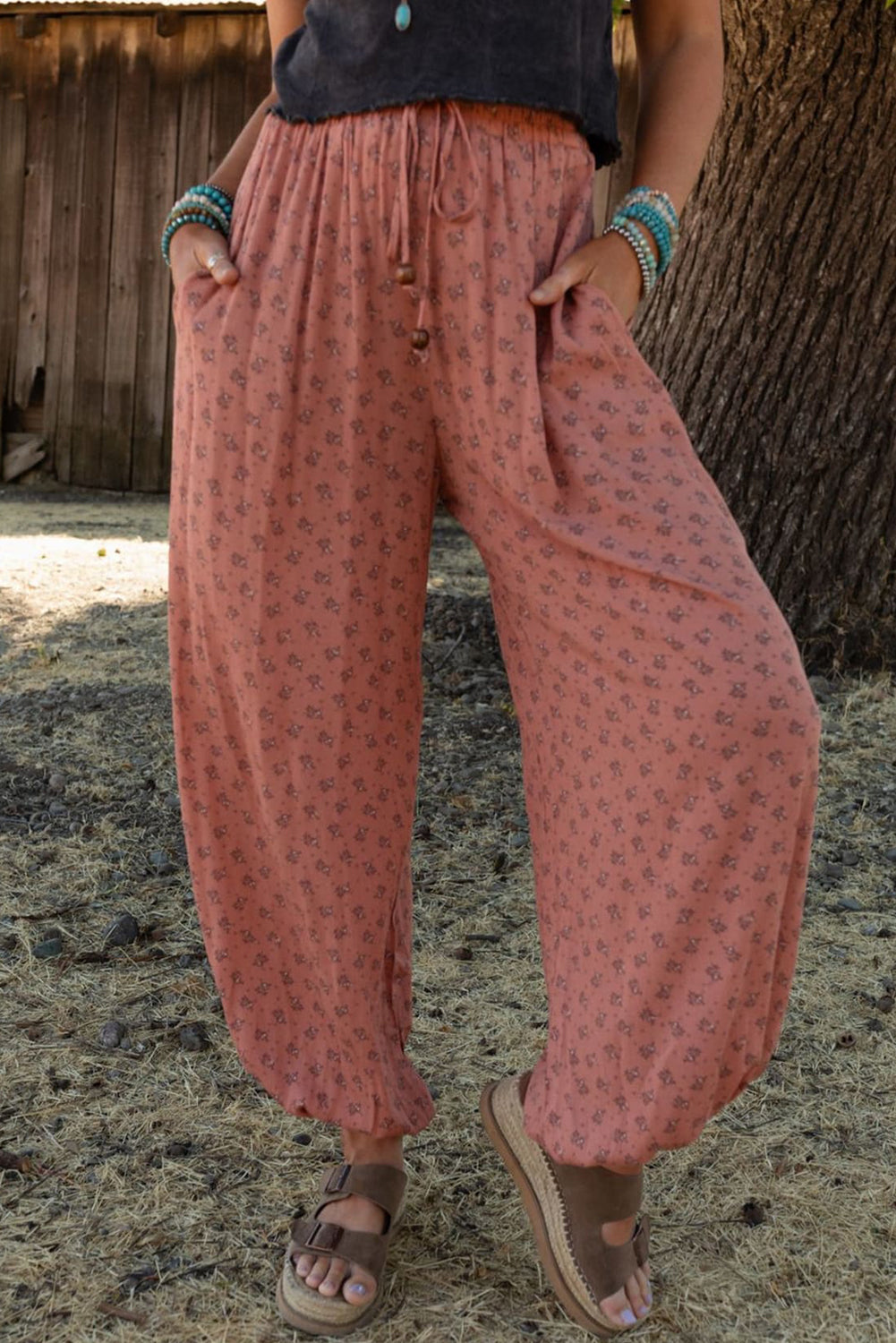 Pink boho floral printed wide leg jogger pants with drawstring closure.