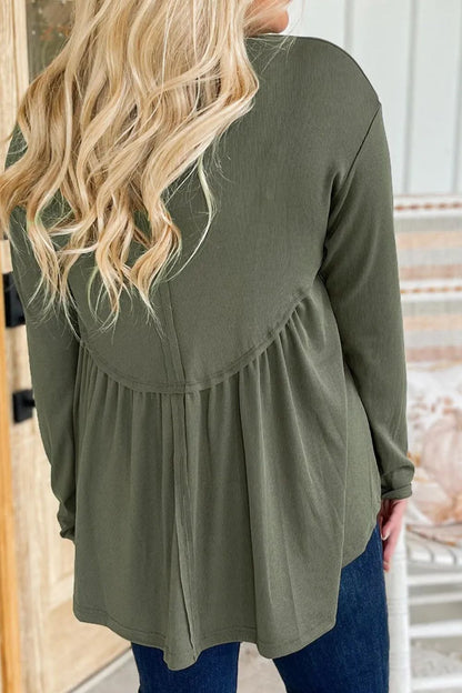 Plus size peplum round neck long sleeve blouse in green.