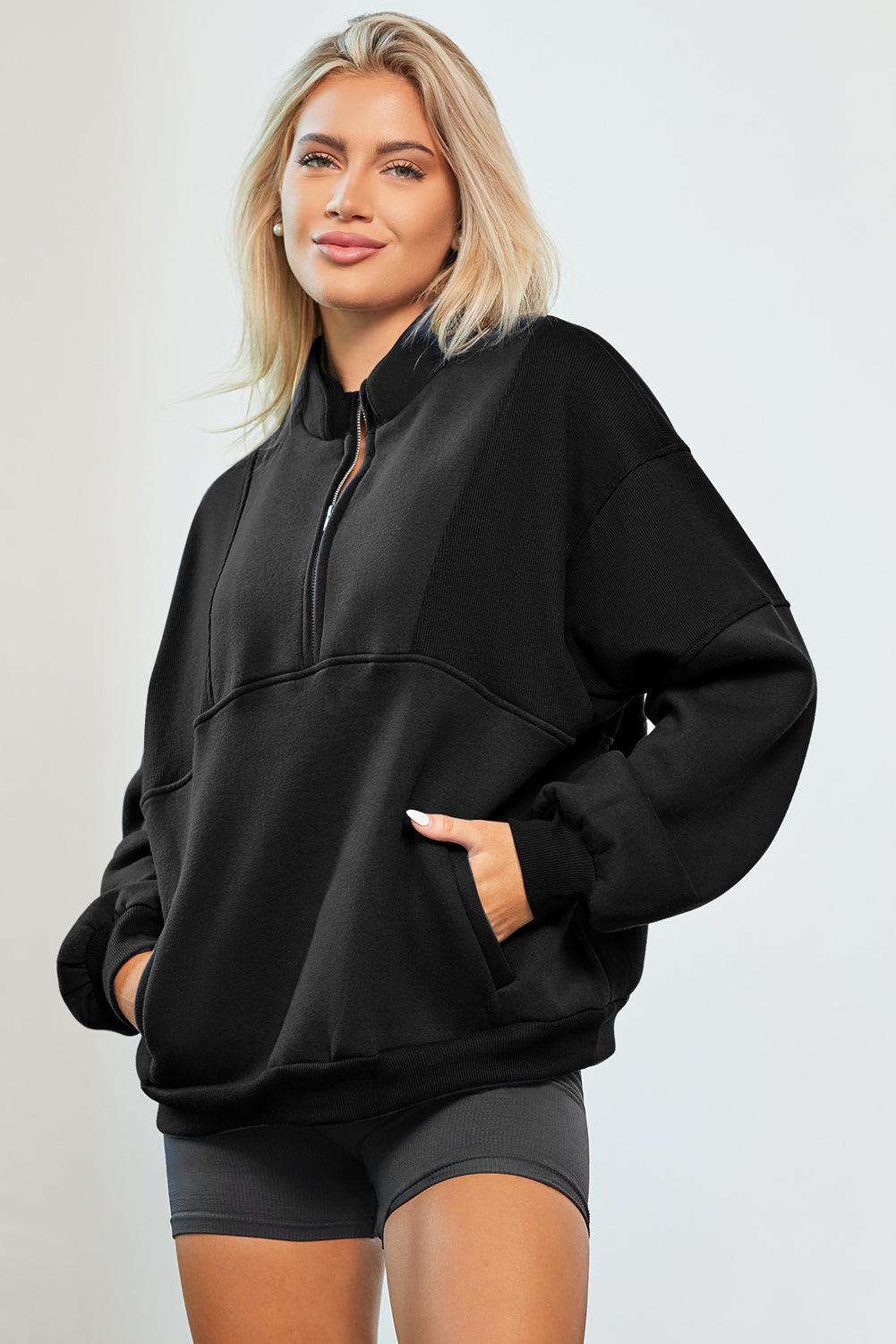 Oversized half zip dropped shoulder sweatshirt, black, pocketed, no stretch, polyester and cotton blend.