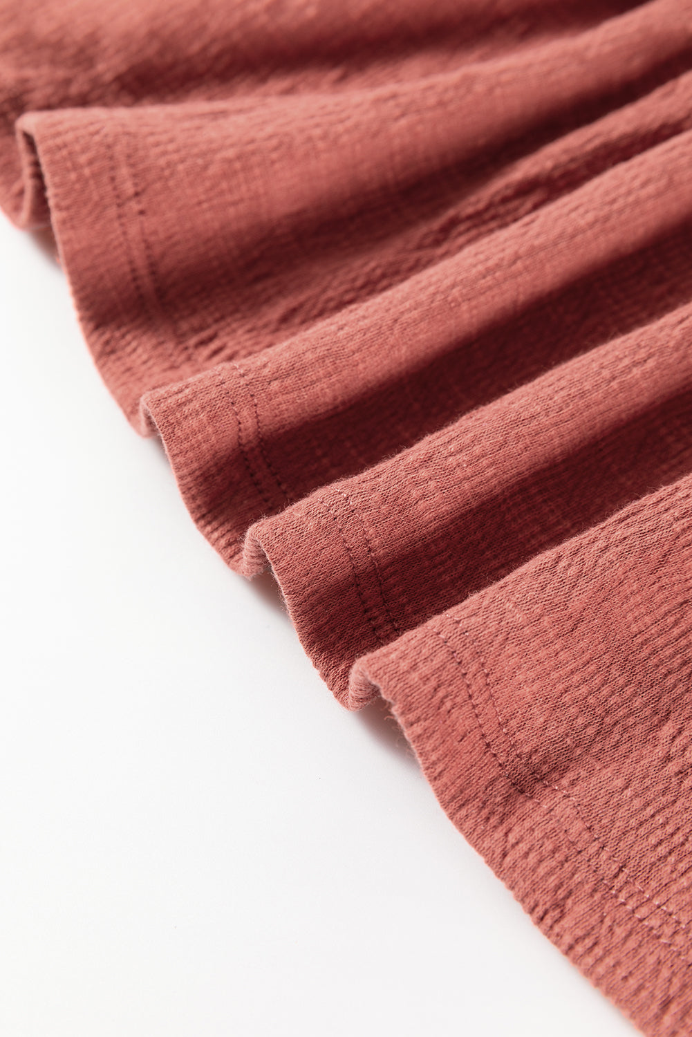 Ruffled detail of Boho Frill Long Sleeve Blouse fabric in a warm hue.