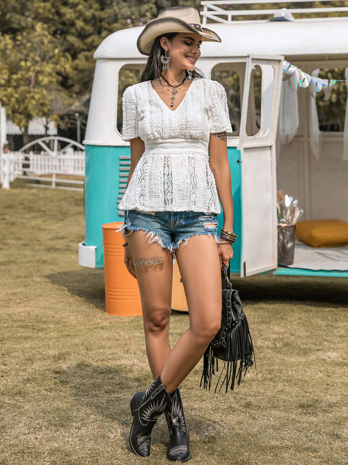 Lace V-neck short sleeve top with semi-sheer design and slightly stretchy material.