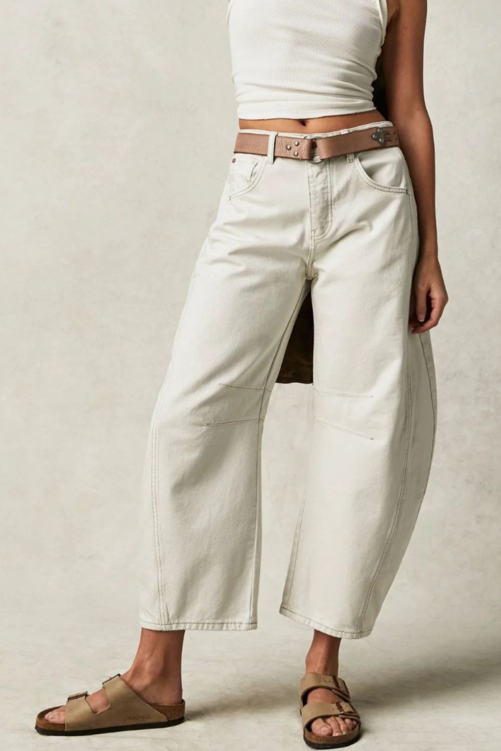 Wide leg barrel jeans with pockets, buttoned design, no stretch, cotton blend.