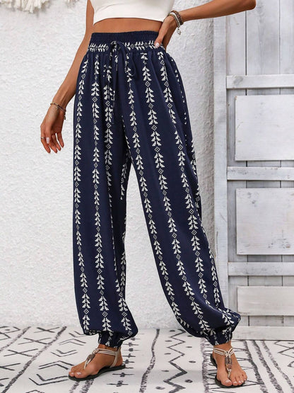 Tied printed high waist pants with blue and white pattern.