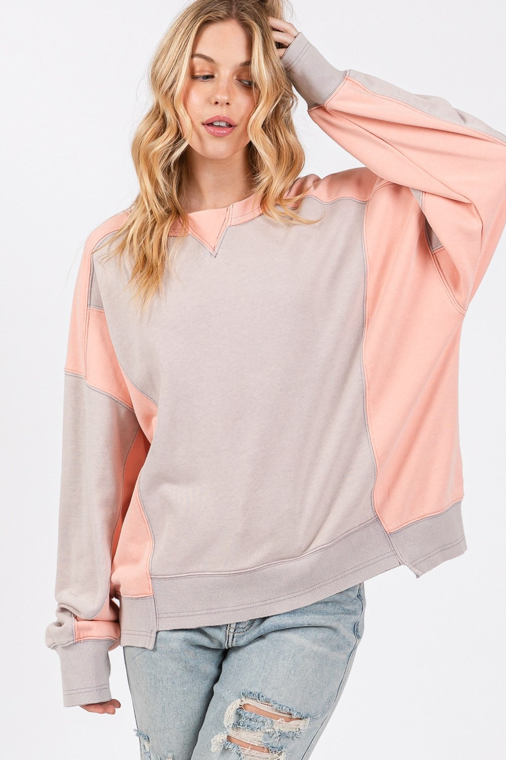 Color block round neck relaxed fit sweatshirt with ribbed trim and dropped sleeves.