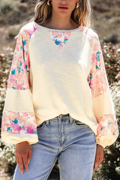 Printed round neck balloon sleeve blouse with floral pattern, polyester-cotton blend.