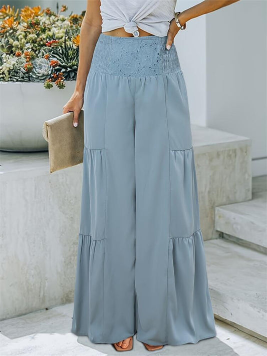 Smocked high waist pants in blue, featuring a wide leg design and crochet waistband.