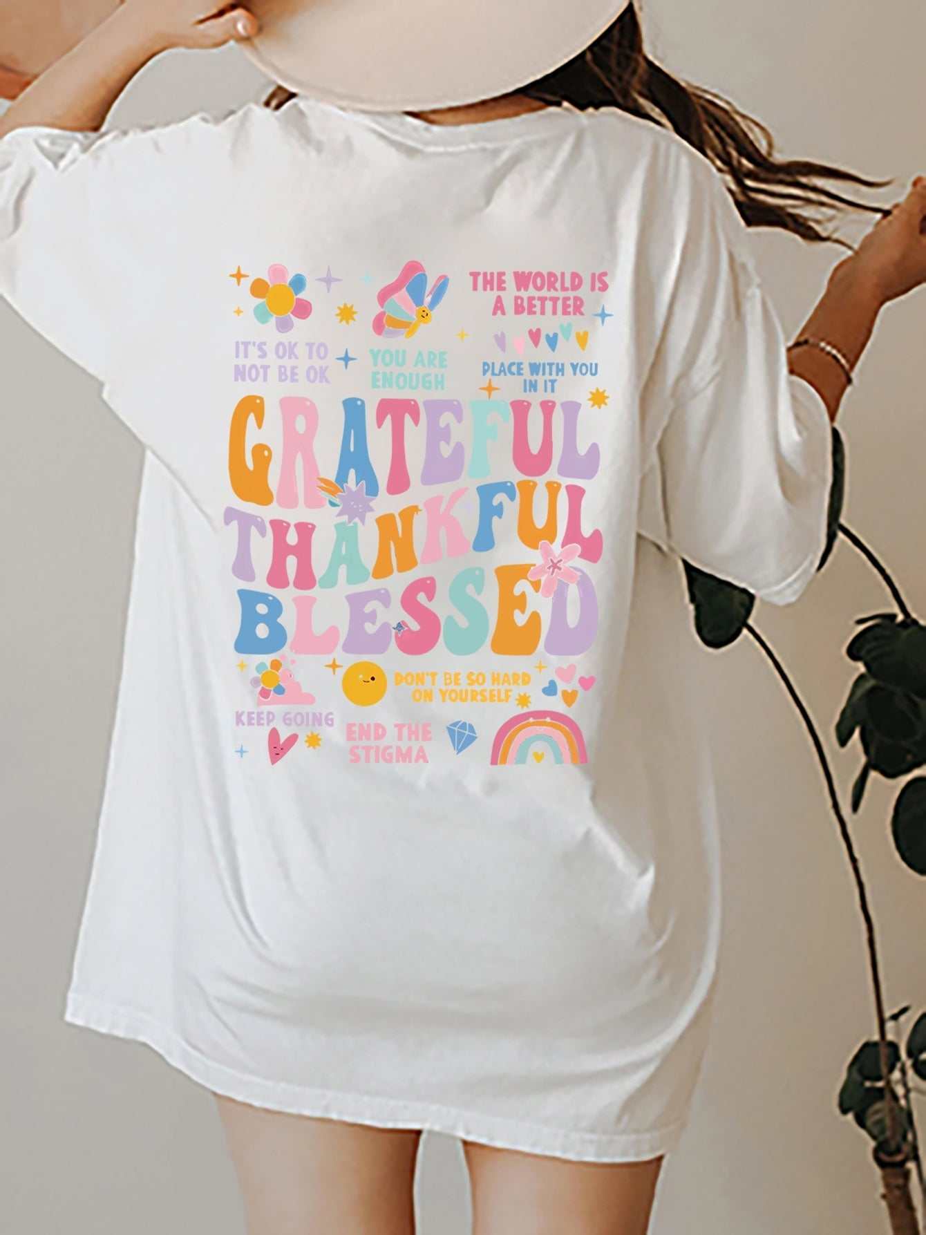 Grateful Thankful Blessed graphic T-shirt with colorful design and motivational words, made of polyester.