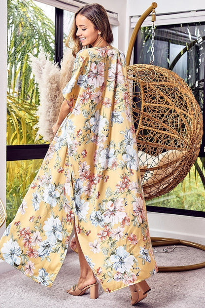 Floral side slit longline cardigan with romantic print displayed indoors.