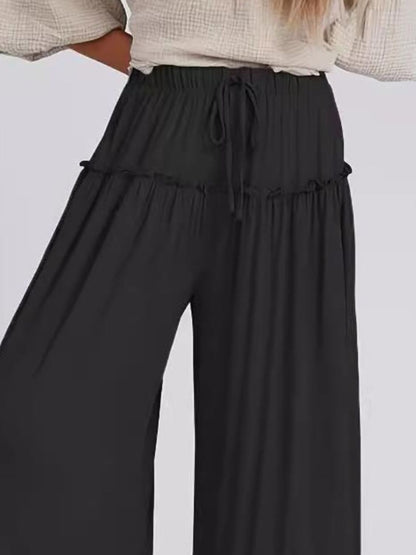 Full Size Frill Wide Leg Pants with drawstring in black, 100% polyester, opaque fabric.