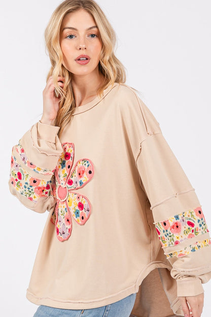 Daisy Patch Applique Long Sleeve Sweatshirt with floral design and exposed seam detail.