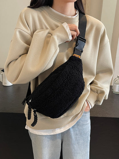 Medium Sherpa crossbody bag in black polyester with adjustable strap.