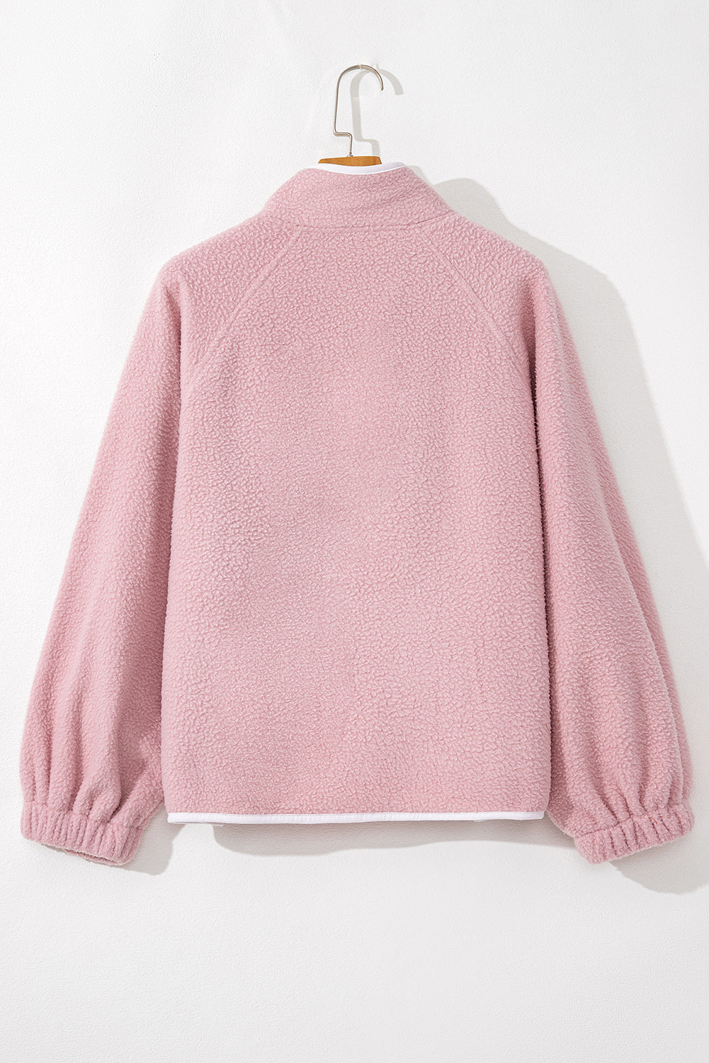 Pink half snap long sleeve fleece jacket with soft texture and elastic cuffs.