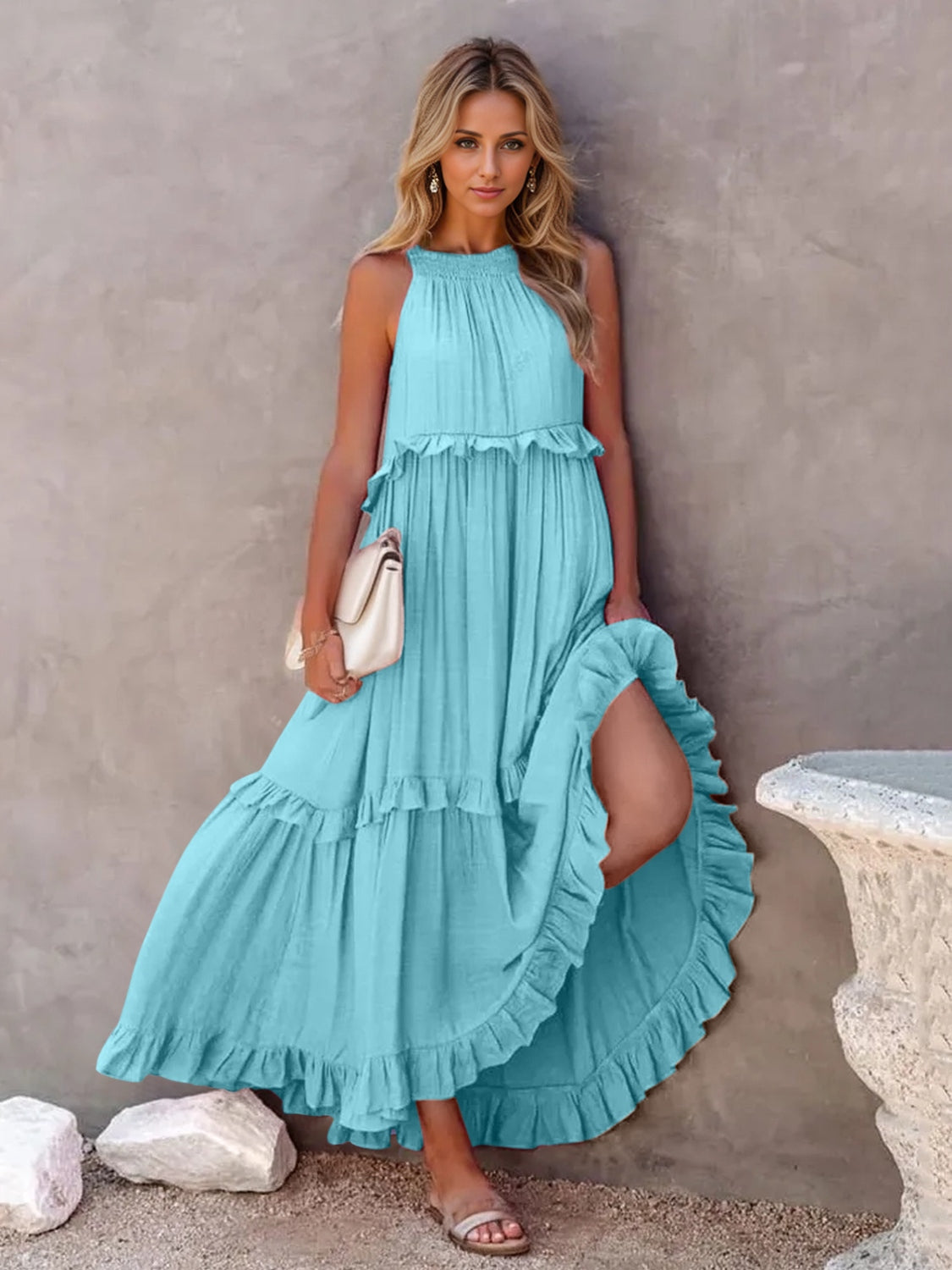 Ruffled sleeveless tiered maxi dress with pockets in blue, featuring high-low design and smocked details.